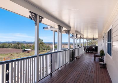 Condamine River Rd, (9) | Freeman Quality Builder Warwick QLD Open rural farmland with low rolling hills and scattered trees under a wide blue sky on Condamine River Road property.