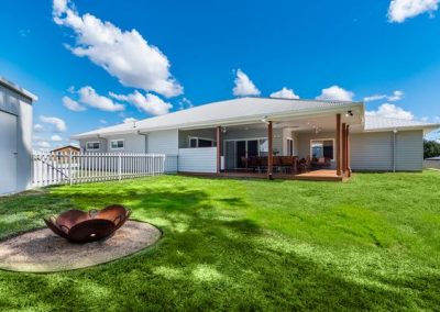 Flynn Dr, 54 (25) | Freeman Quality Builder Warwick QLD Modern contemporary home exterior with illuminated entry and landscaped front yard.