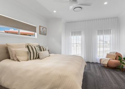 Flynn Dr, 54 (28) | Freeman Quality Builder Warwick QLD Modern residential house exterior with warm lighting and landscaped garden at dusk.