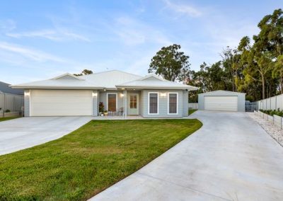 Flynn Dr, 54 (32) | Freeman Quality Builder Warwick QLD Contemporary home exterior with warm entrance lighting and landscaped driveway.