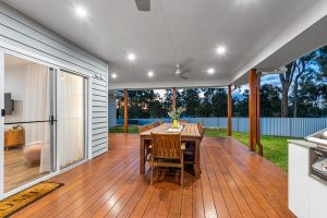 Contemporary house exterior with landscaped front yard and double garage.
